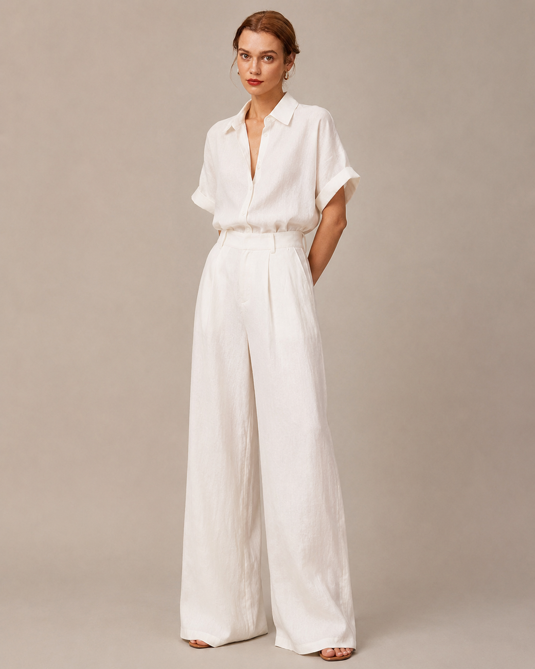 White short-sleeve shirt and wide-leg pant matching set.