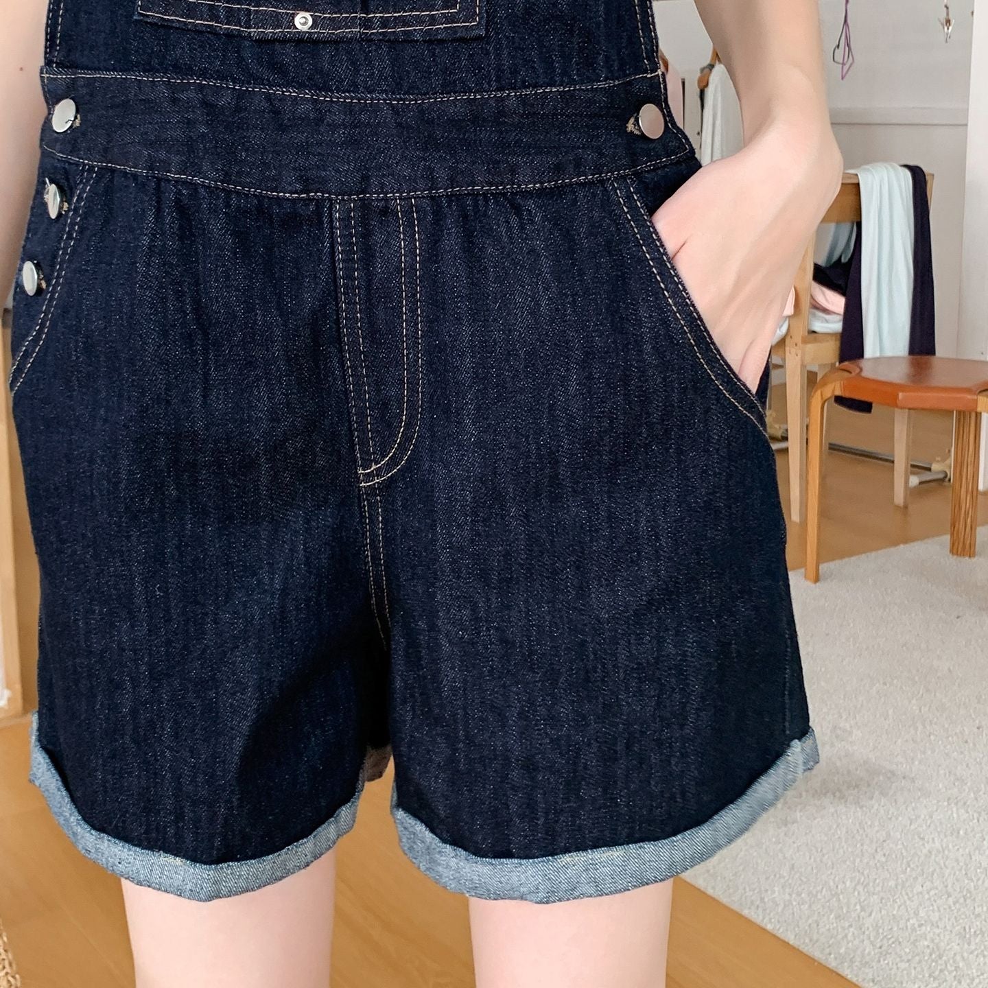 Denim relaxed overall romper, front pocket and side-button detail