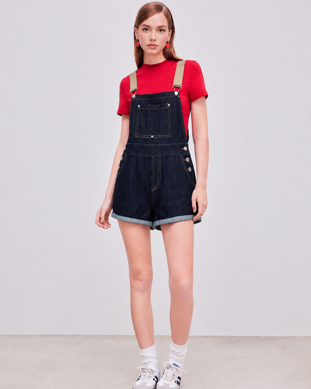 Denim relaxed overall romper on model, full front view