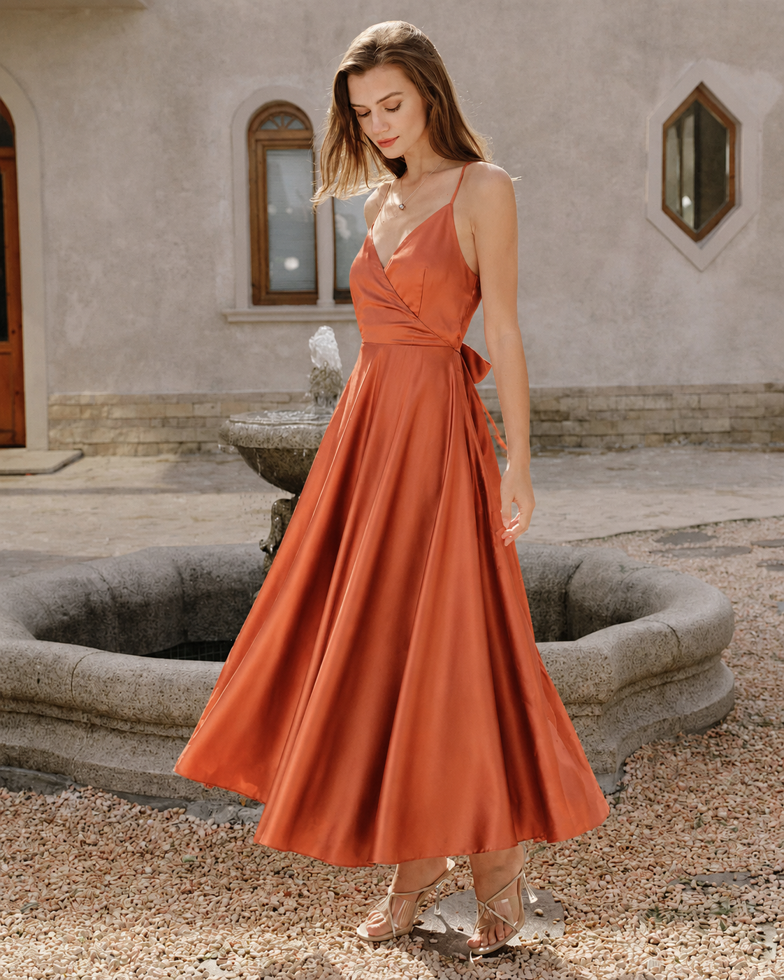 Orange open-back satin-look maxi dress, outdoor three-quarter view