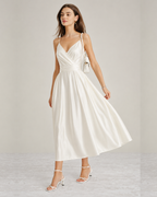 White open-back satin-look maxi dress with handbag, front view