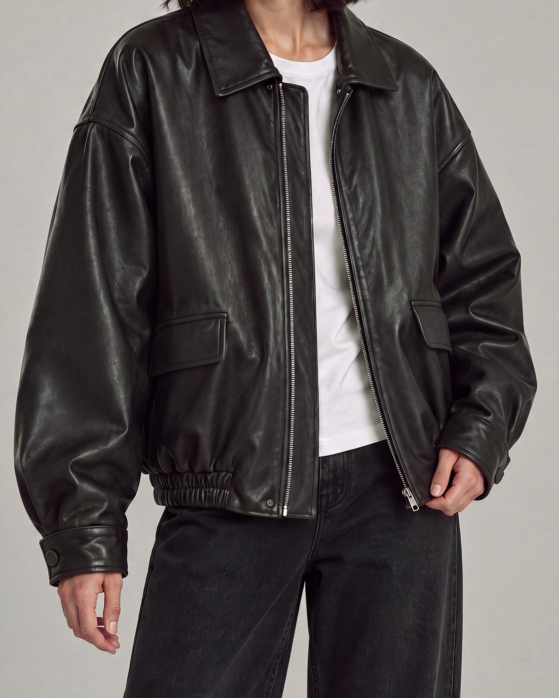 Relaxed Faux-Leather Zip Jacket in Black — neck down