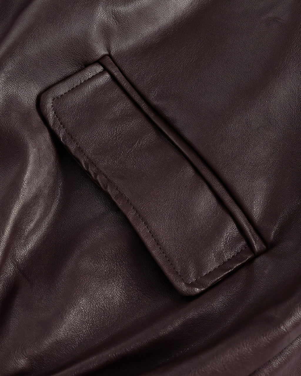 Relaxed Faux-Leather Zip Jacket in Brown — detail pocket hem