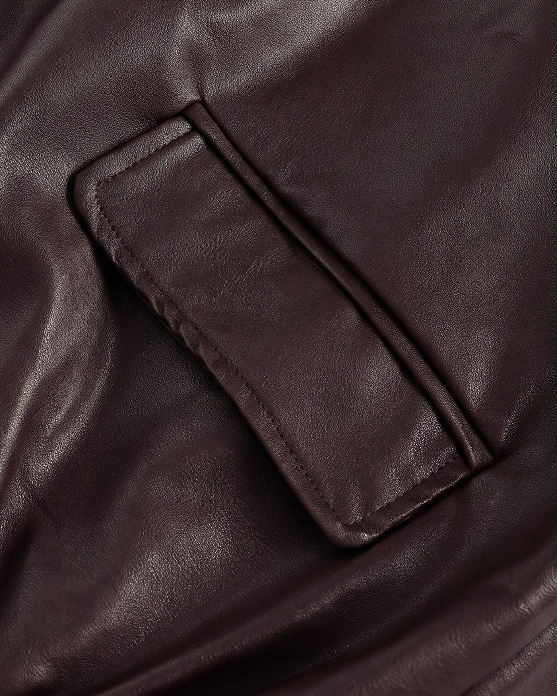 Relaxed Faux-Leather Zip Jacket in Brown — detail pocket hem