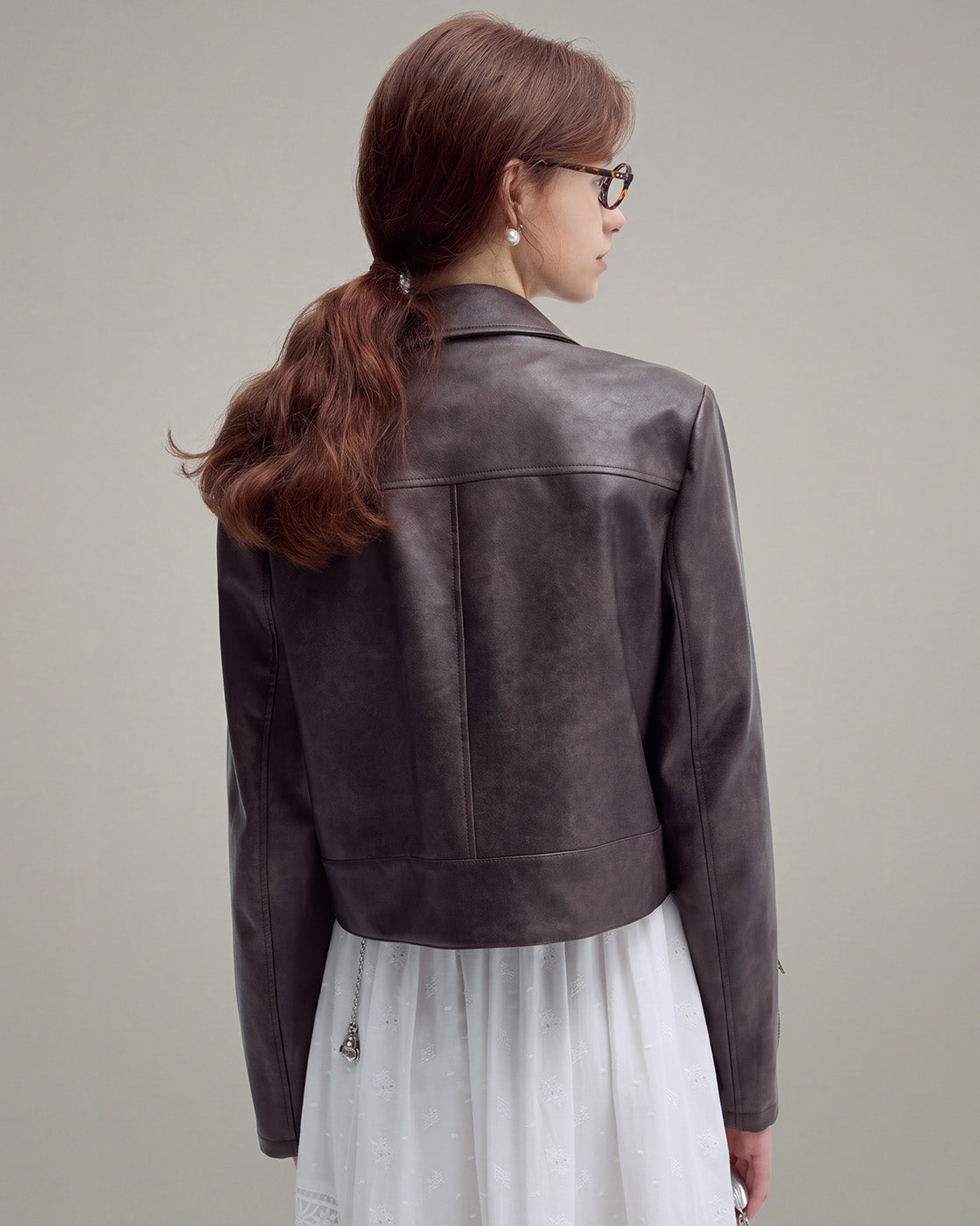 Buckle-Hem Faux-Leather Jacket in Brown — model back