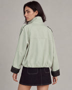 Contrast-Cuff Cropped Trench Jacket in Light Green — model back