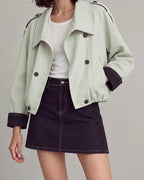 Contrast-Cuff Cropped Trench Jacket in Light Green — neck down