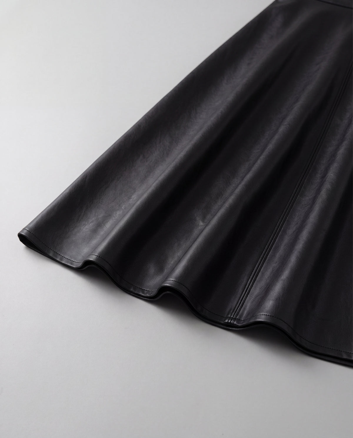PU A-Line Midi Skirt — Black, hem detail
