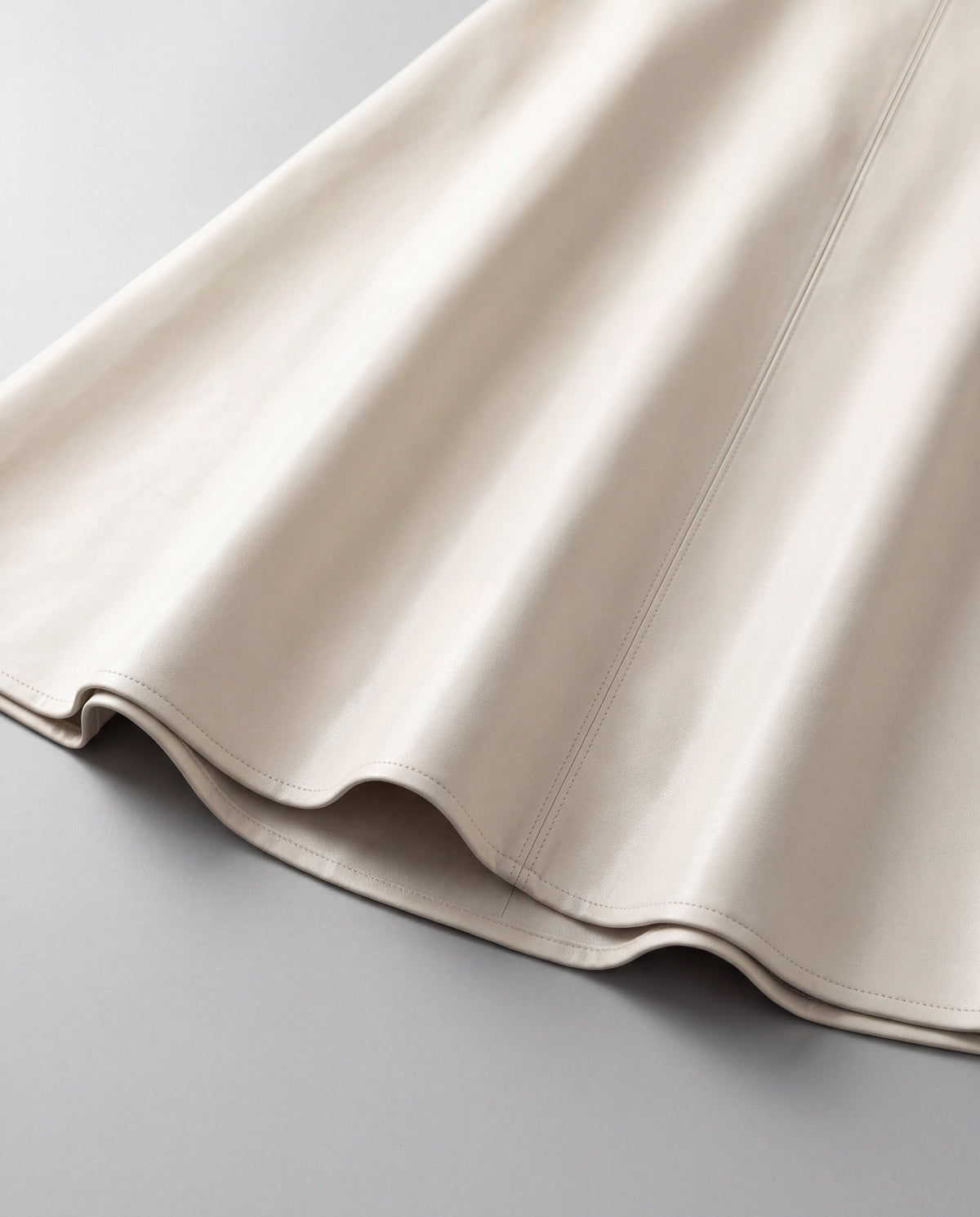 PU A-Line Midi Skirt — Ivory, hem detail
