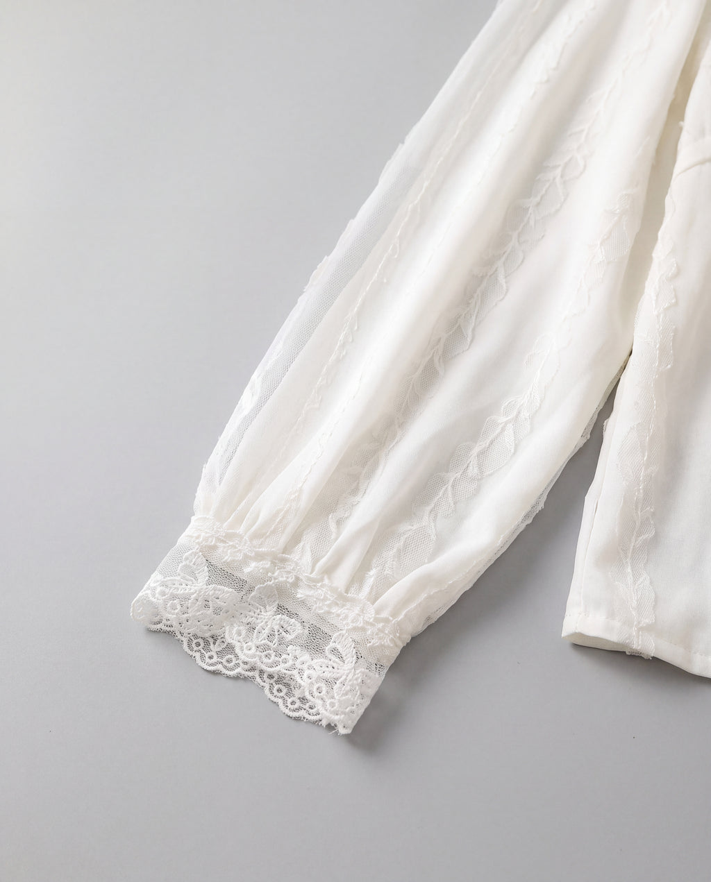 Lace-Trim V-Neck Blouse — White, cuff detail