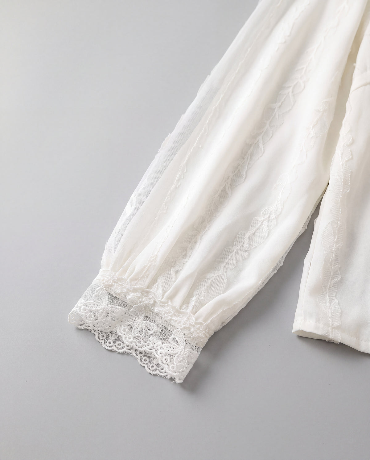 Lace-Trim V-Neck Blouse — White, cuff detail