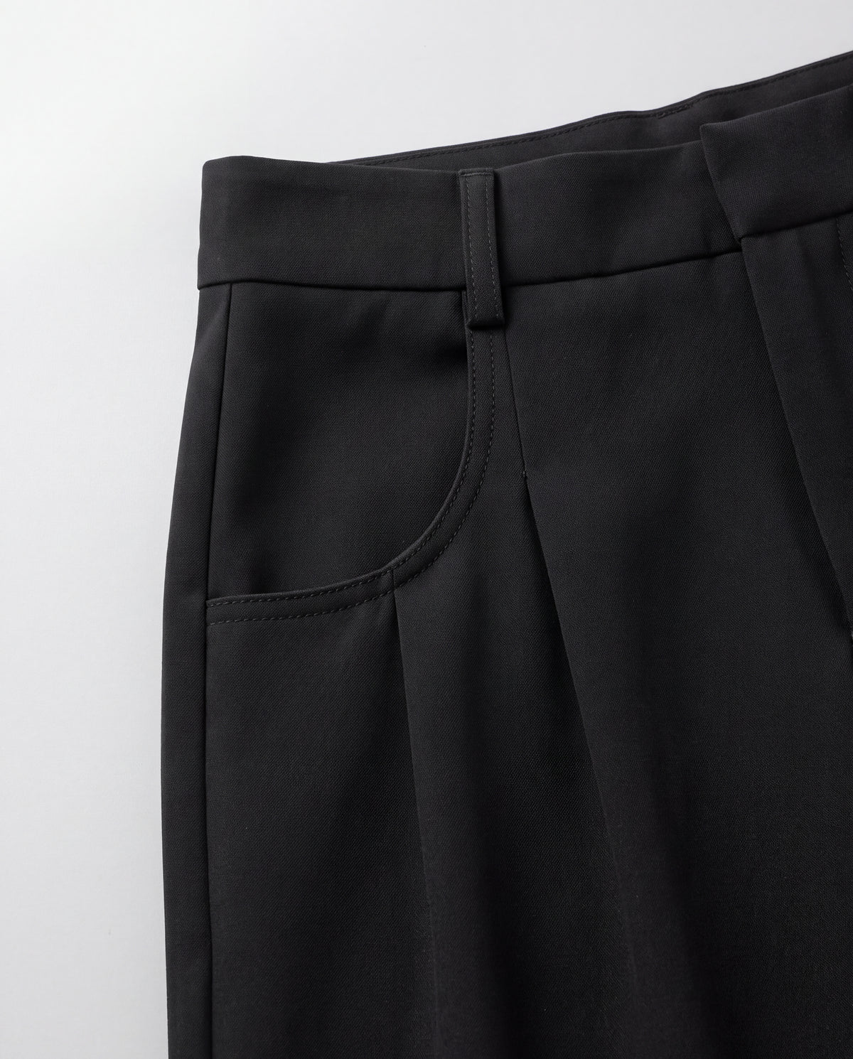 High-Rise Pleated Wide-Leg Trousers — Black, waistband detail