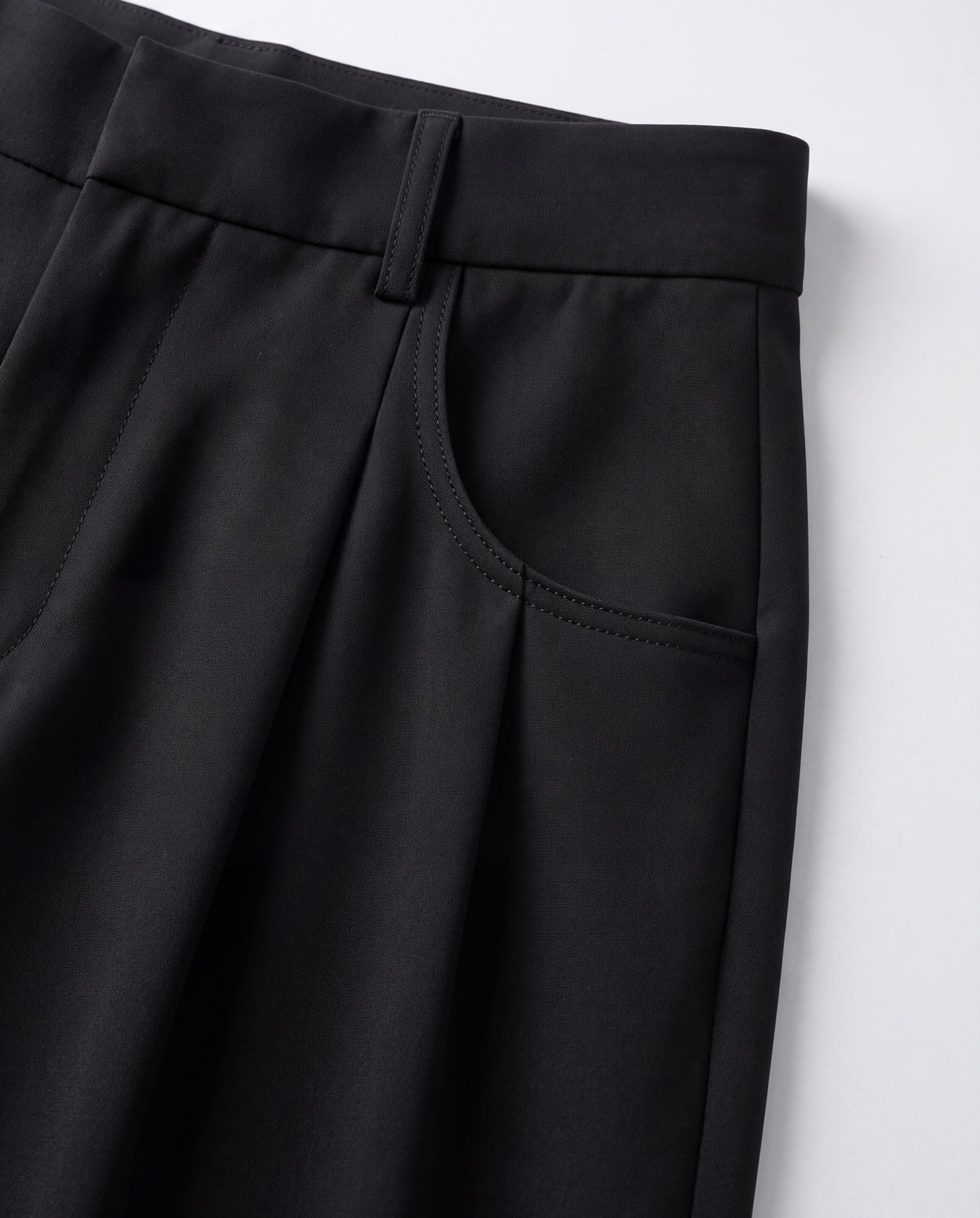 High-Rise Pleated Wide-Leg Trousers — Black, pocket detail