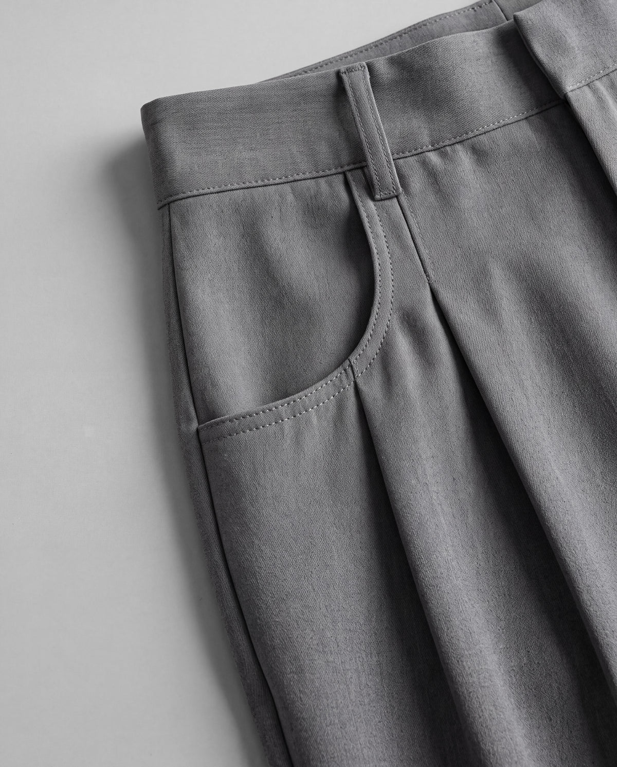 High-Rise Pleated Wide-Leg Trousers — Gray, pocket detail