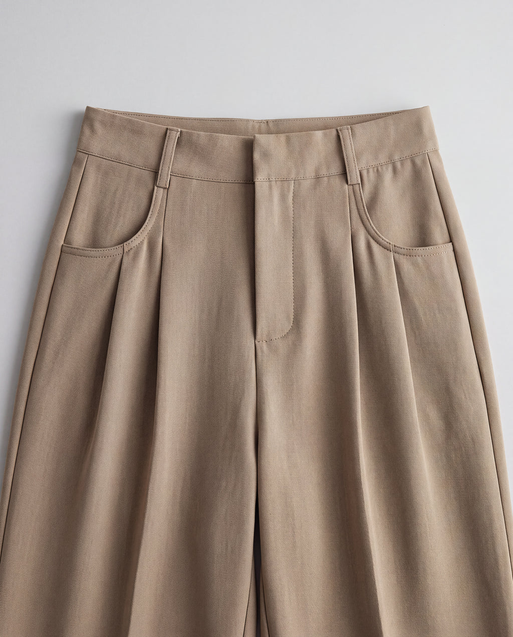 High-Rise Pleated Wide-Leg Trousers — Khaki, waistband detail