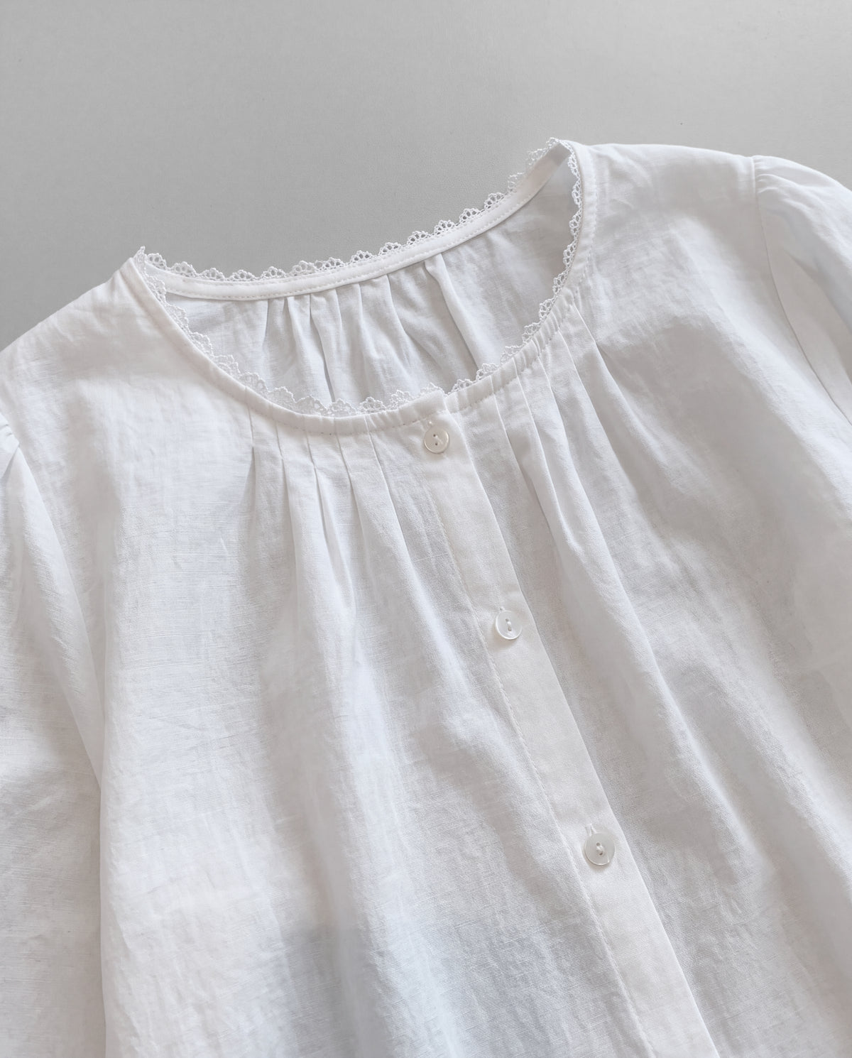 Lace-Trim Puff Sleeve Blouse — White, neckline detail