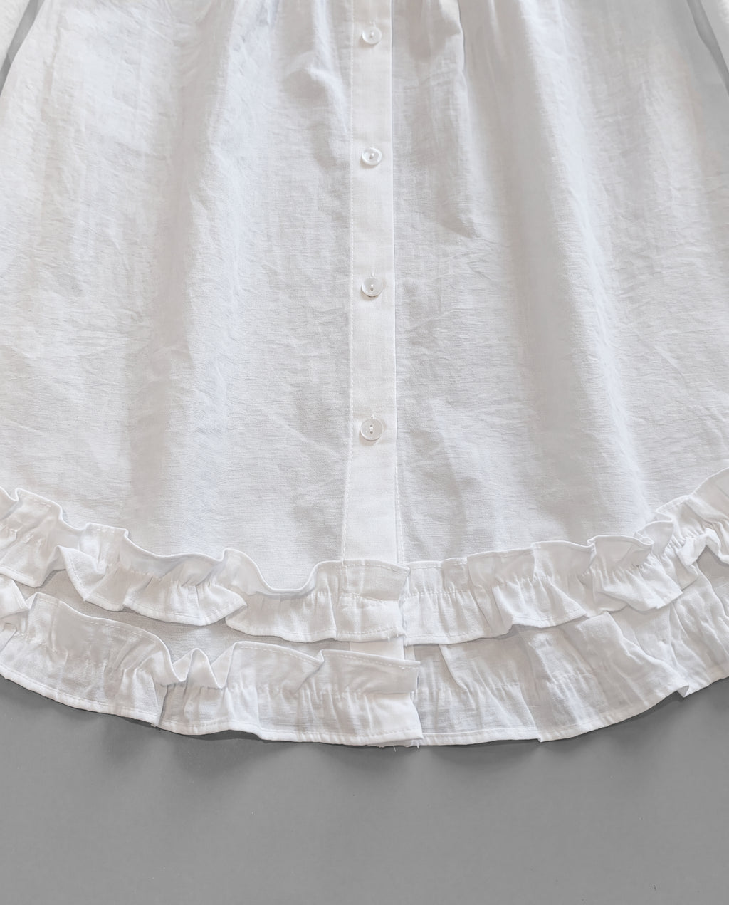 Lace-Trim Puff Sleeve Blouse — White, hem detail