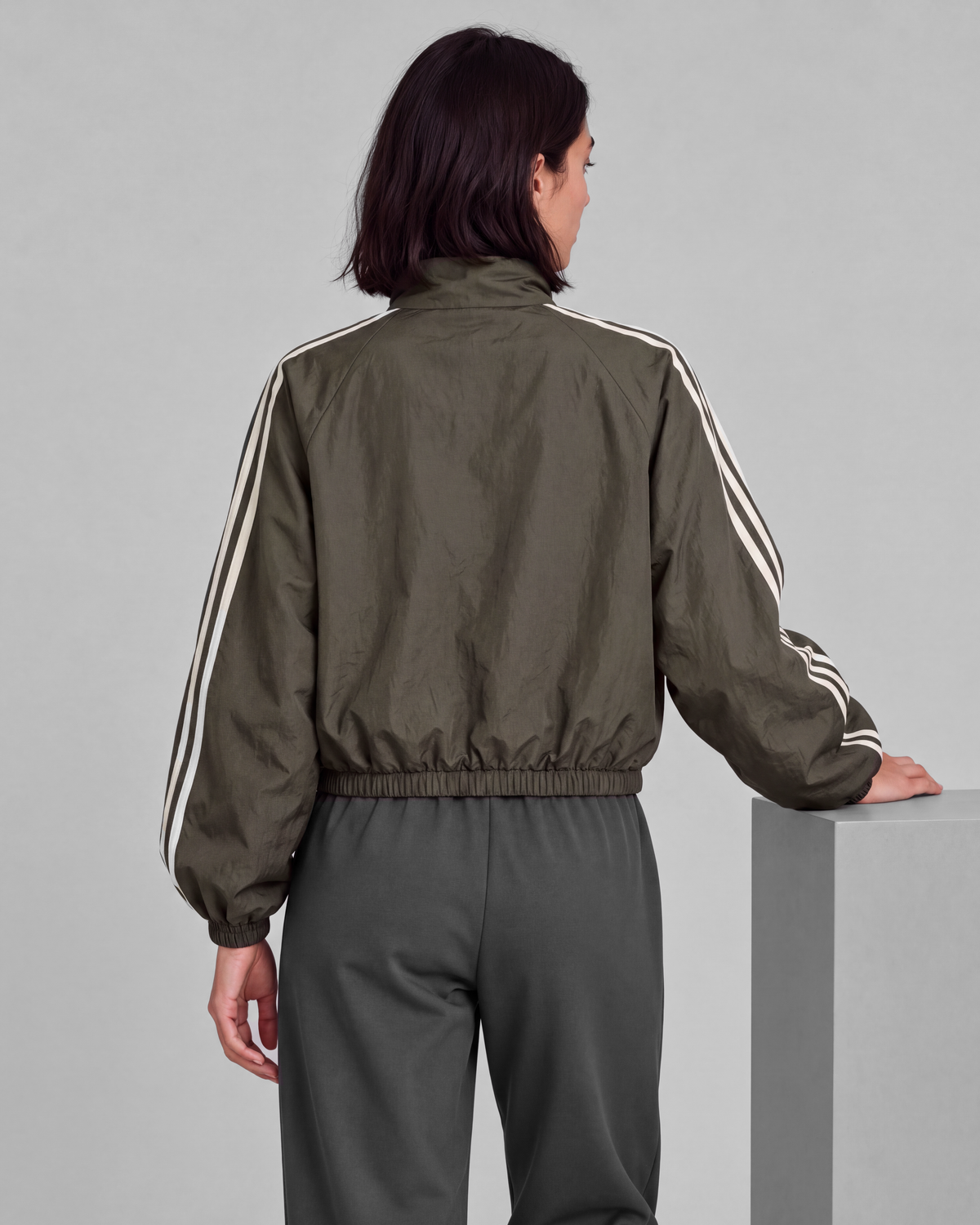 Dark olive-gray jacket, back close view on model