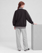 Black jacket, back full-length view on model
