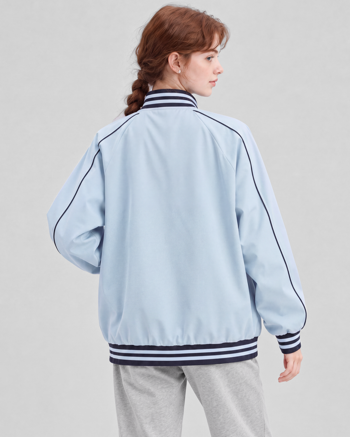Light blue jacket, back close view on model