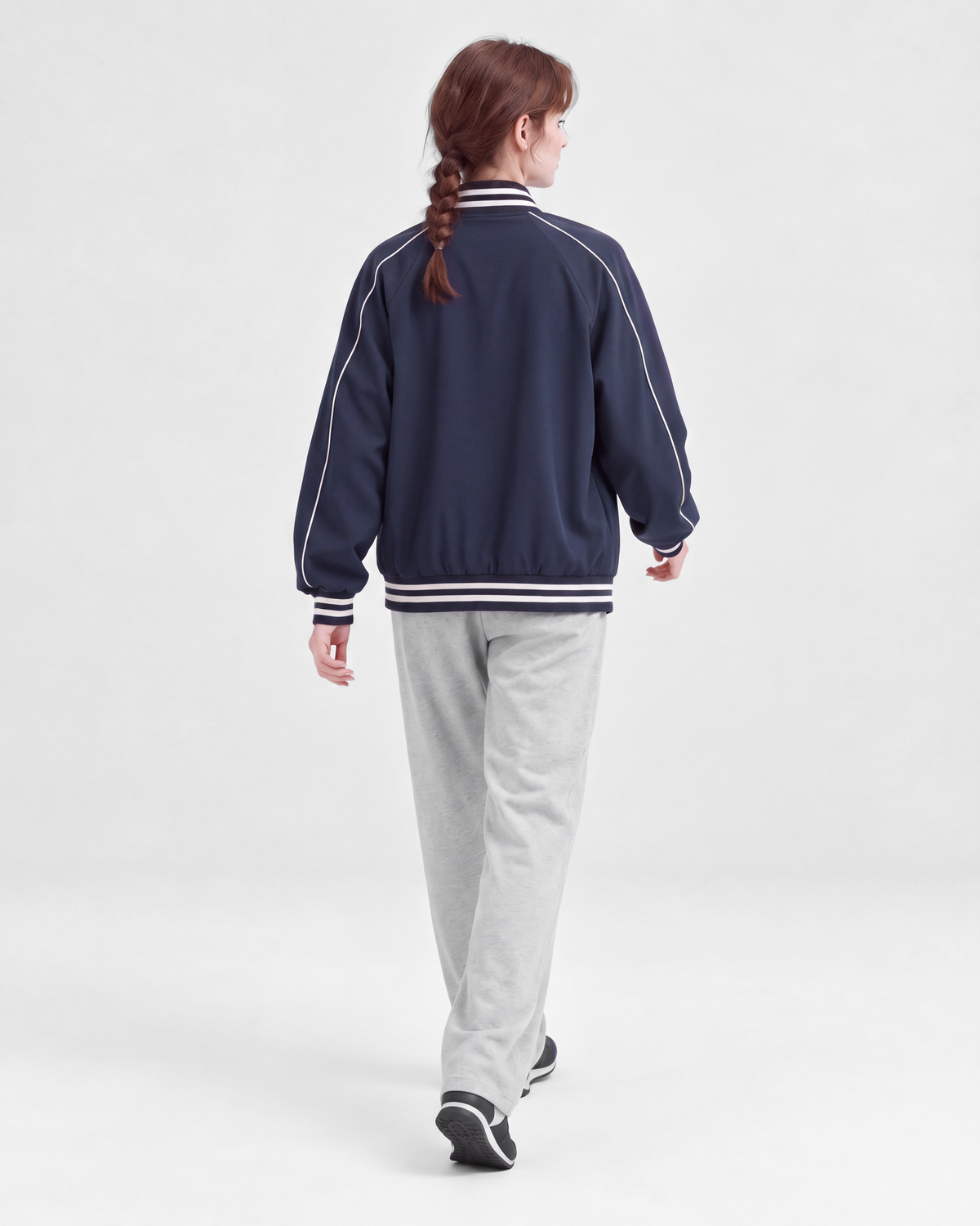 Navy jacket, back full-length view on model