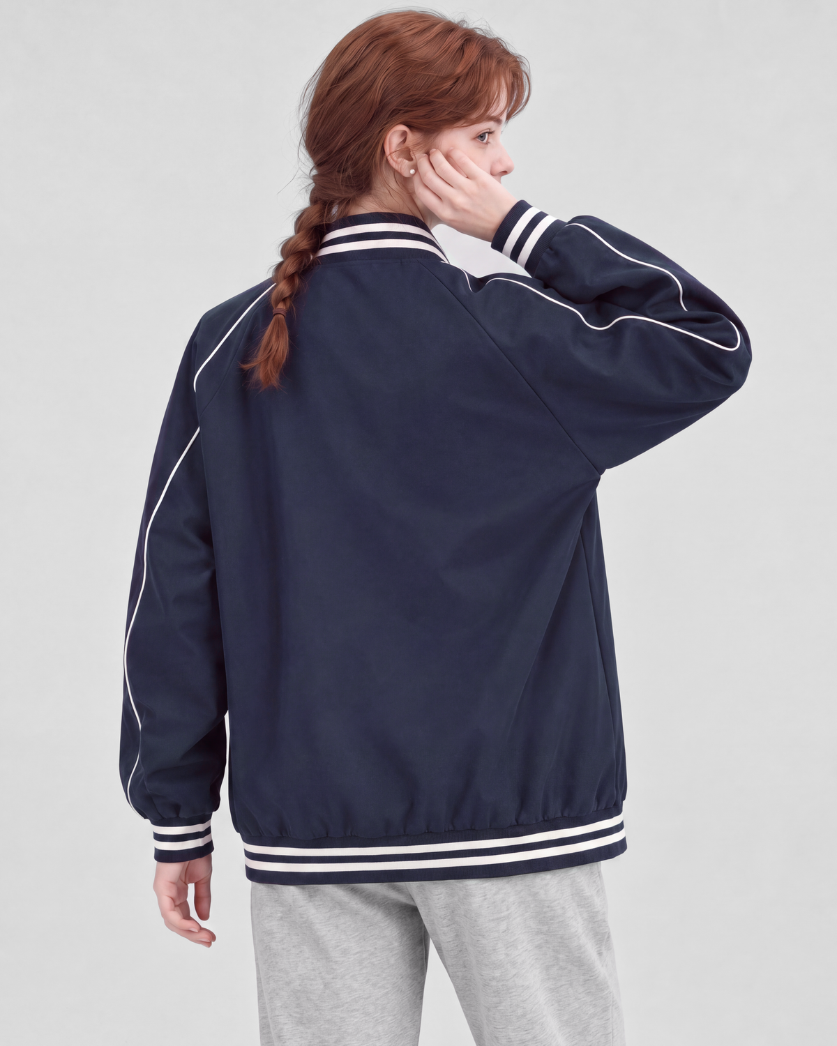 Navy jacket, back close view on model