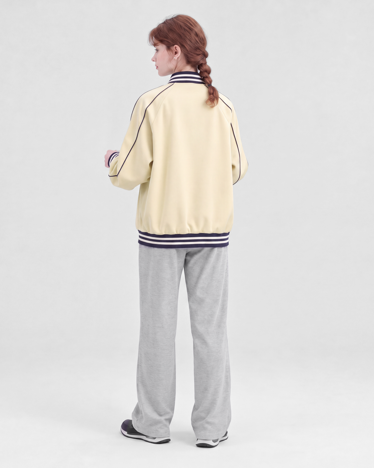 Pale yellow jacket, back full-length view on model