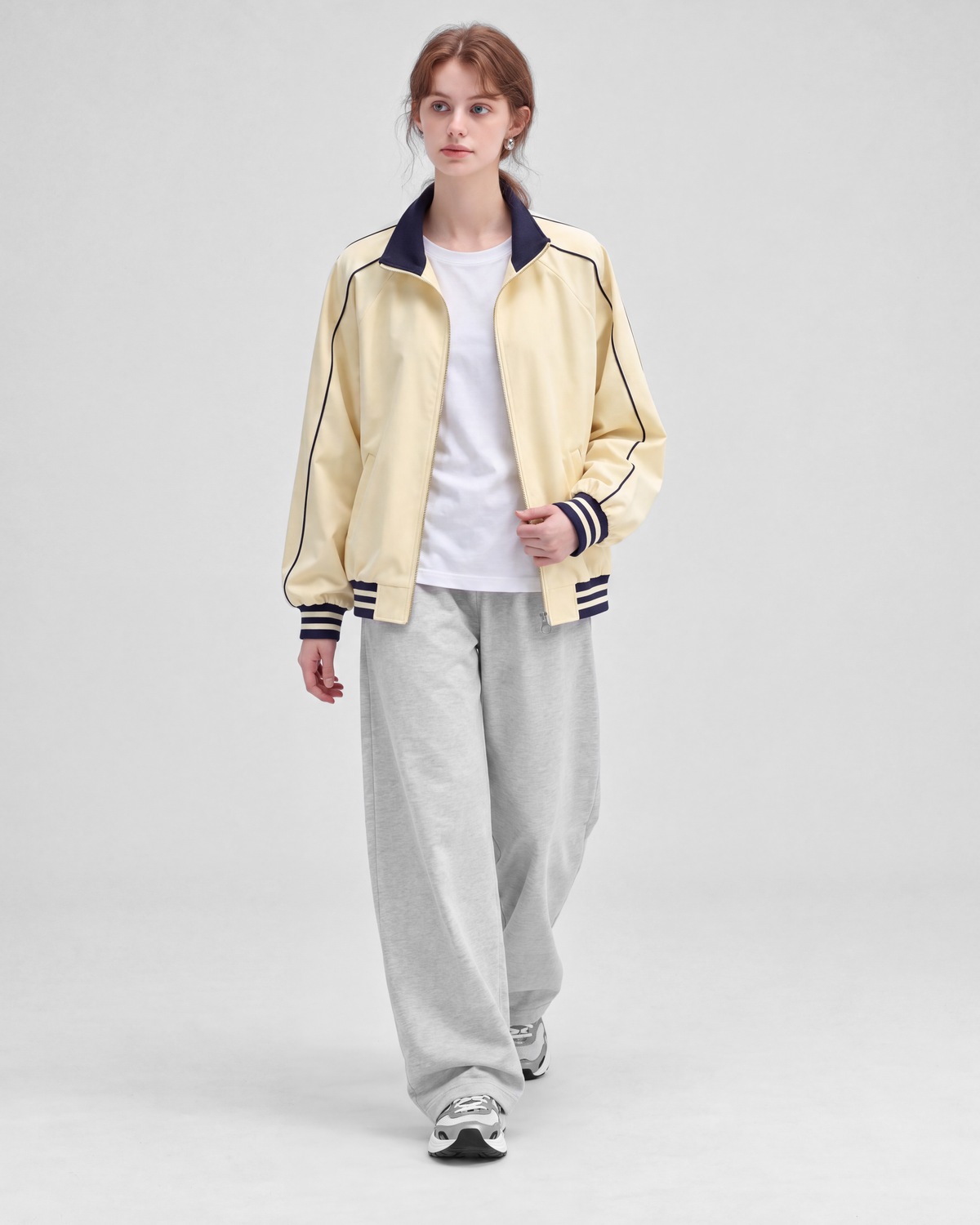 Pale yellow jacket, front full-length view on model