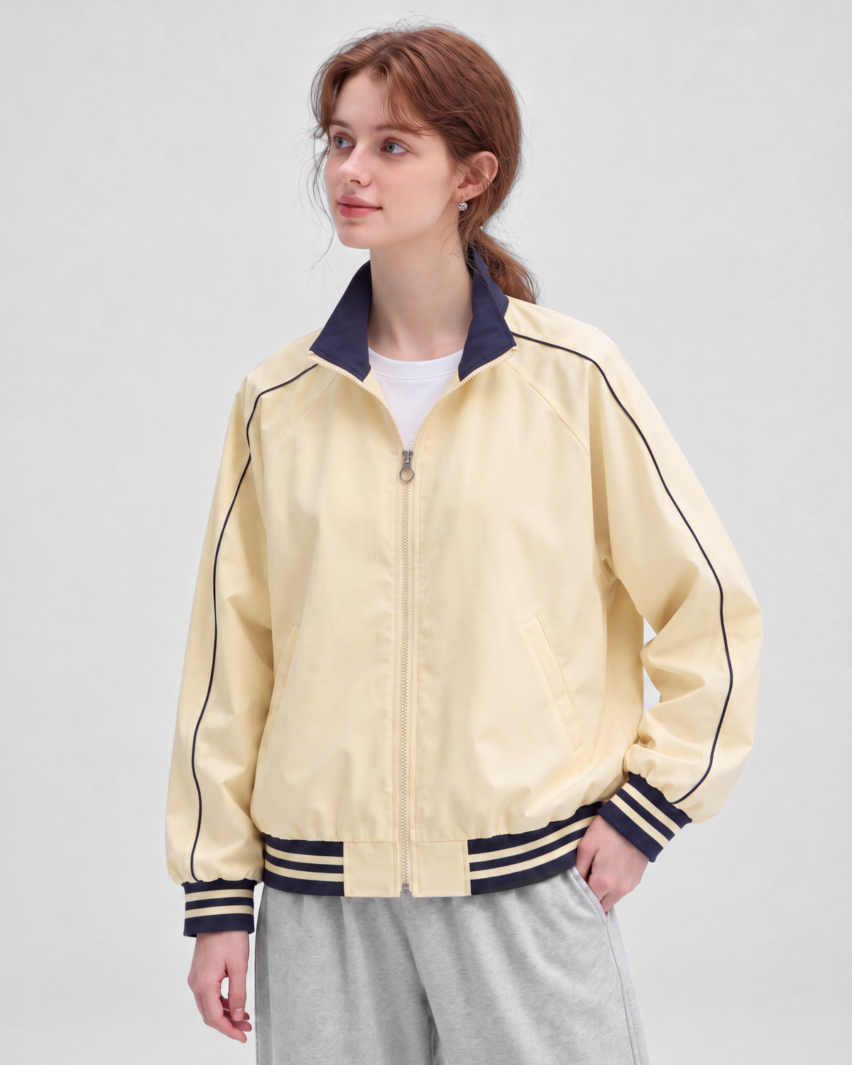 Pale yellow jacket, front view on model