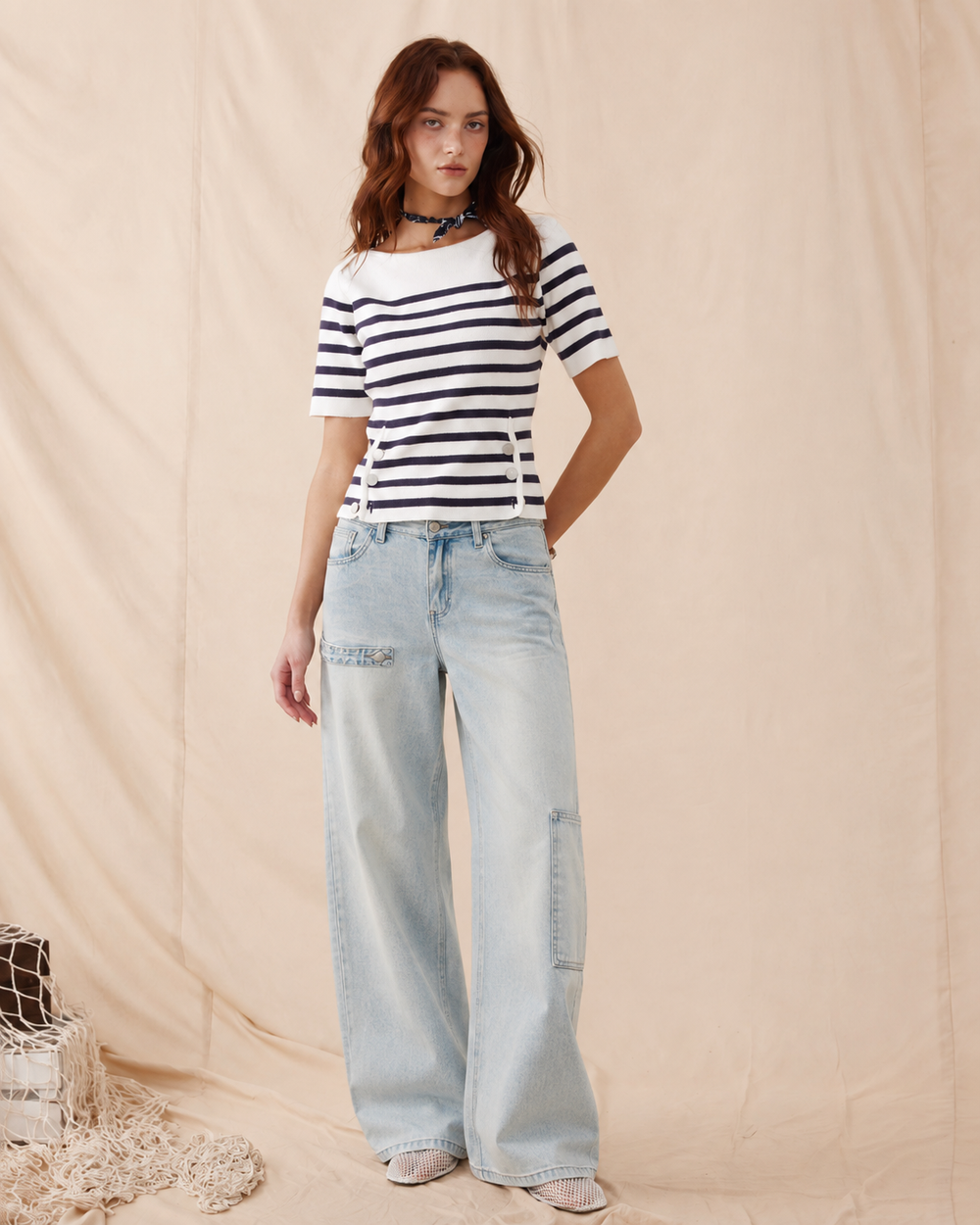 Model wearing light blue Aylora barrel-leg jeans