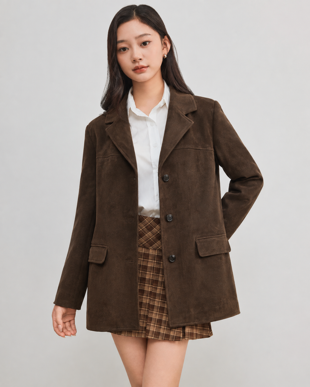 Model wearing an Aylora coffee brown faux-suede blazer