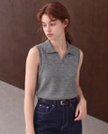 Workday Edit Look 02 – Gray collared sweater vest 92929, upper-body view with Raw Indigo high-rise jeans 003754 and original wood wall scene.
