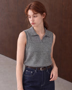 Workday Edit Look 02 – Gray collared sweater vest 92929, upper-body view with Raw Indigo high-rise jeans 003754 and original wood wall scene.